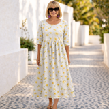 Cláudia | Vestido de Estampado Floral com Ambiente de Verão